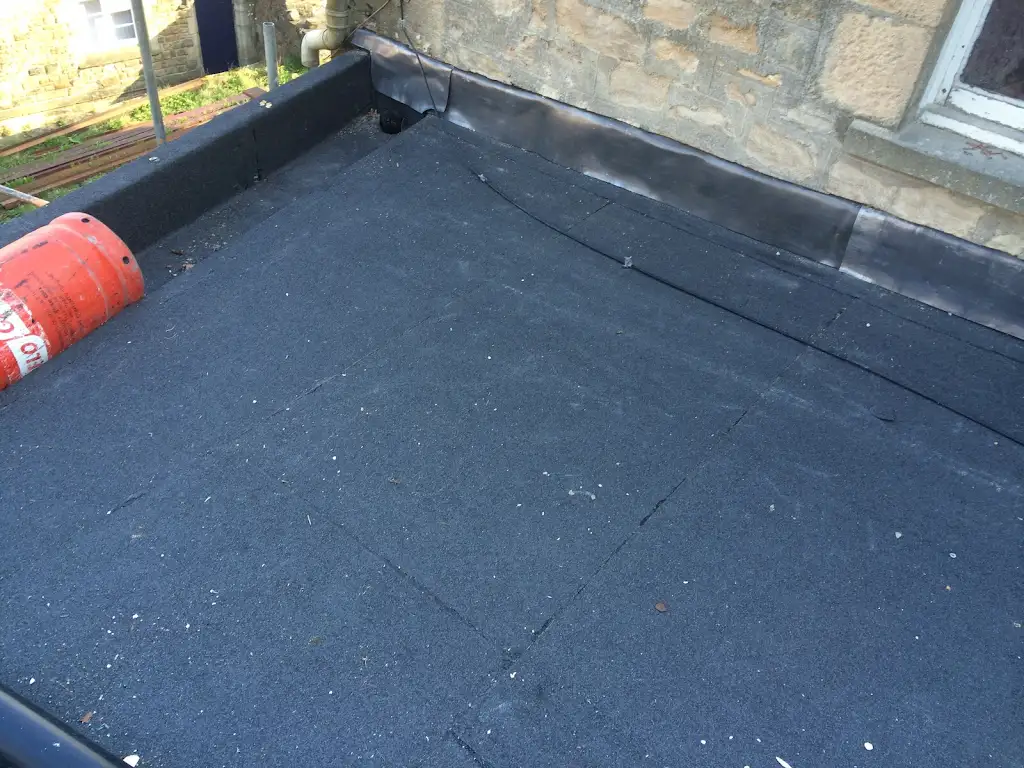 Black felt flat roof with lead upstands